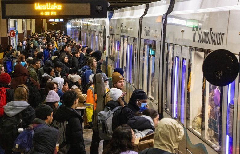 Passengers at Westlake Station prepare to board a single-tracked light rail train heading north during the afternoon commute, Wednesday, Jan. 17, 2024 in Seattle.