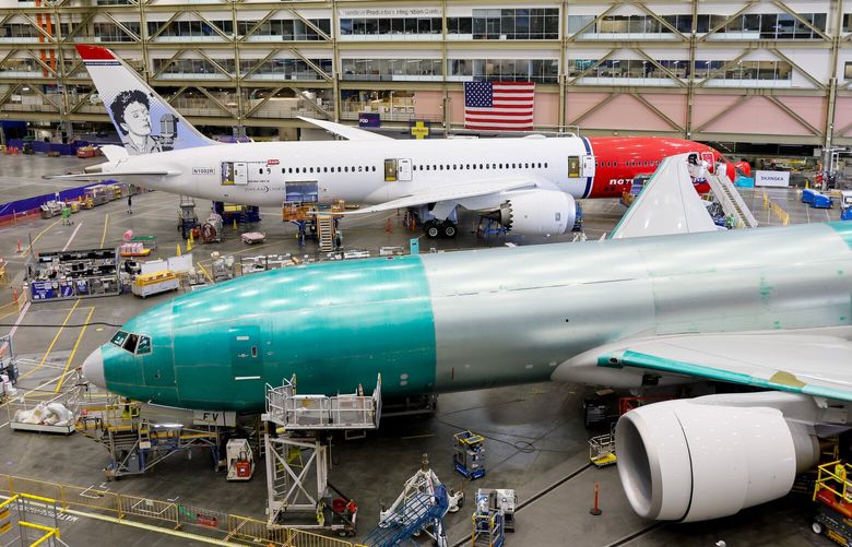 **Image is embargoed to Sat., July 20, at 12:01 GMT, Fri., July 19 at 8:01 p.m. ET and 5:01 p.m. PT**

A 787-9 and a 777 share a bay at the Boeing Everett Production Facility Wednesday, June 26, 2024 in Everett, WA. 227341