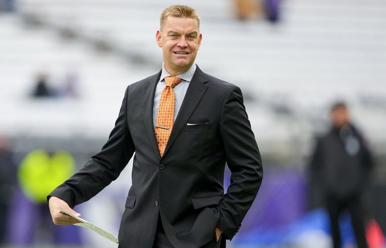Former NFL and Washington quarterback Brock Huard walks on the field before calling an NCAA college football game between Washington and Utah for Fox Sports, Saturday, Nov. 11, 2023, in Seattle. The final football season for the Pac-12 with its current membership is coming to a thrilling conclusion. The conference wraps up regular-season play this week before the title game in Las Vegas on Dec. 1, 2023. Washington and Oregon still have hopes of getting the Pac-12 its first College Football Playoff berth since 2016. (AP Photo/Lindsey Wasson)
