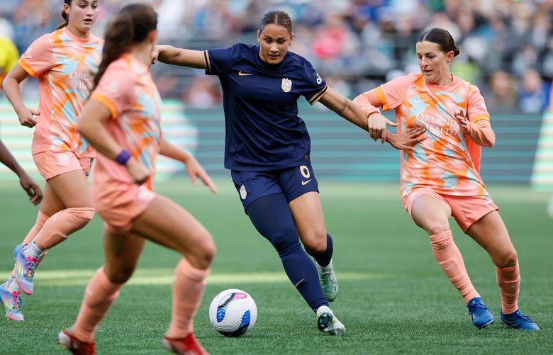 Seattle Reign FC forward Lynn Biyendolo dribbles in traffic during the second half against the Orlando Pride Saturday, April 12, 2025 in Seattle. 229713