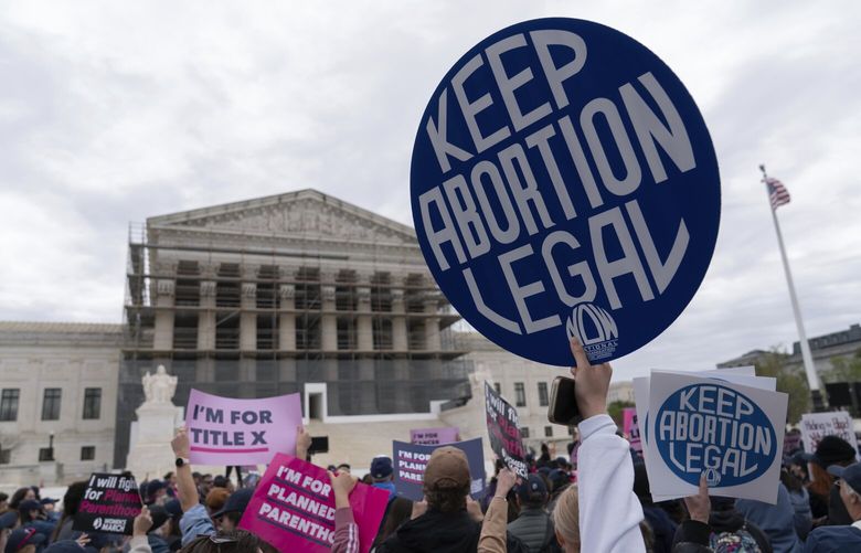 FILE – Abortion-rights activists rally outside the Supreme Court in Washington, Wednesday, April 2, 2025. (AP Photo/Jose Luis Magana, file) LLT505 LLT505