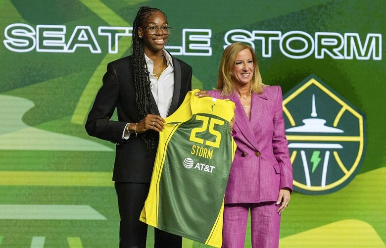 Dominique Malonga, left, poses with WNBA commissioner Cathy Engelbert after being selected second overall by the Seattle Storm during the first round of the WNBA basketball draft, Monday, April 14, 2025, in New York.