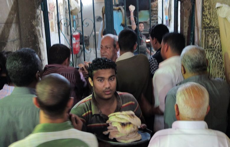 A bread line at a government bakery in Luxor, Egypt, in 2013.
