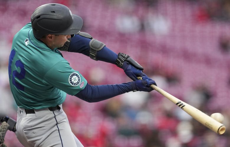 Seattle Mariners’ Ben Williamson hits a single during his major league debut in the second inning of a baseball game against the Cincinnati Reds, Tuesday, April 15, 2025, in Cincinnati. All the players are wearing 42 in honor of Jackie Robinson Day. (AP Photo/Jeff Dean) OHJD104 OHJD104