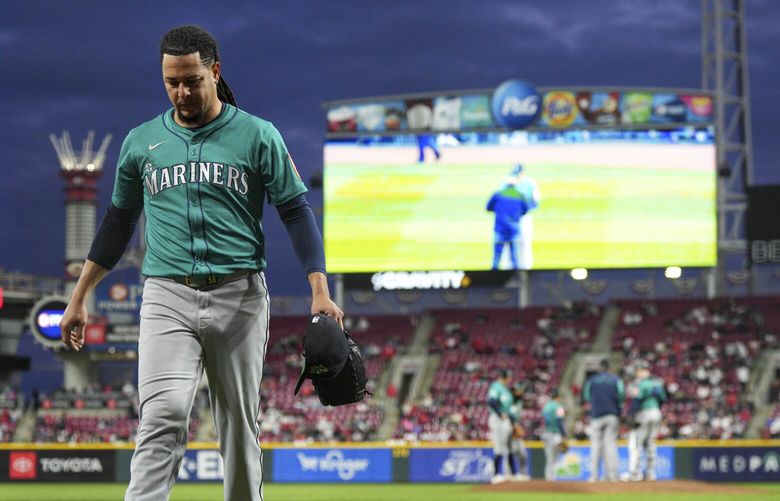Seattle Mariners pitcher Luis Castillo walks to the dugout after a pitching change during the fifth inning of a baseball game against the Cincinnati Reds, Tuesday, April 15, 2025, in Cincinnati. (AP Photo/Jeff Dean) OHJD117 OHJD117