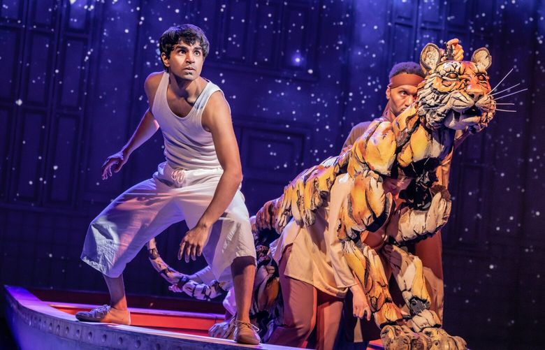 It takes three actor-puppeteers (Anna Leigh Gortner, Shiloh Goodin and Toussaint Jeanlouis) to animate the Bengal tiger Richard Parker in “Life of Pi,” running at the Paramount Theatre through April 20. (Evan Zimmerman for MurphyMade)