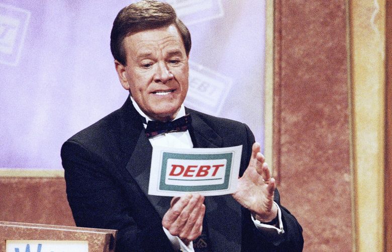 FILE – Host Wink Martindale looks at a card during game show, May 22, 1997. (AP Photo/Nick Ut, File) NYAB204 NYAB204