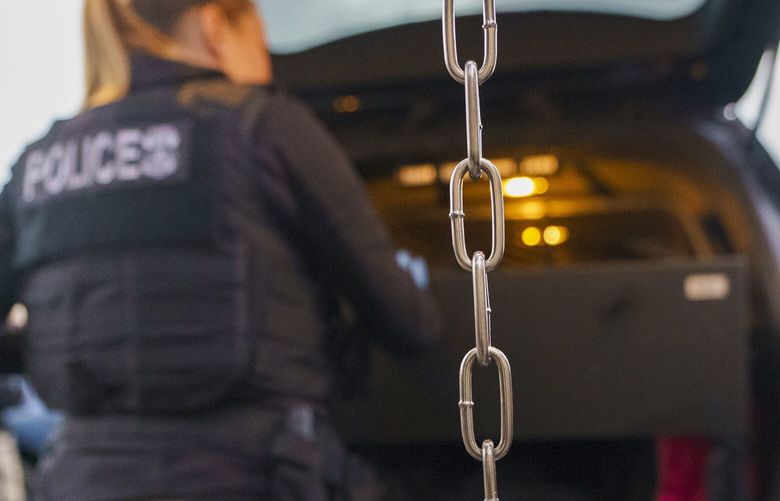 U.S. Immigration and Customs Enforcement agents prepare for a raid to arrest immigrants considered a threat to public safety and national security during an early morning raid, June 6, 2022, in Compton, Calif. CADD102