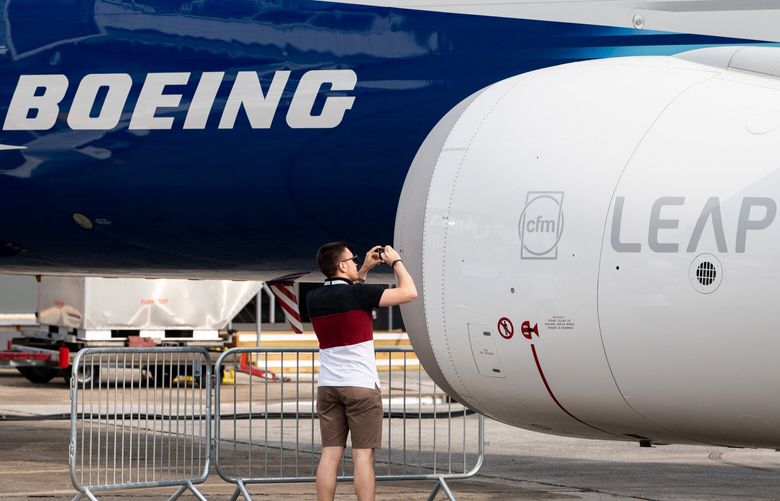 A Paris Air Show visitor photographs the Leap engine of a Boeing 737-10 Max airliner, June 19, 2023, in Le Bourget, Paris, France.