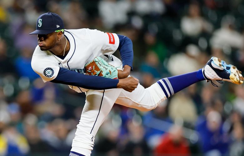 Seattle Mariners relief pitcher Gregory Santos throws out a pitch during the eighth inning Monday, April 7, 2025 in Seattle. 229707