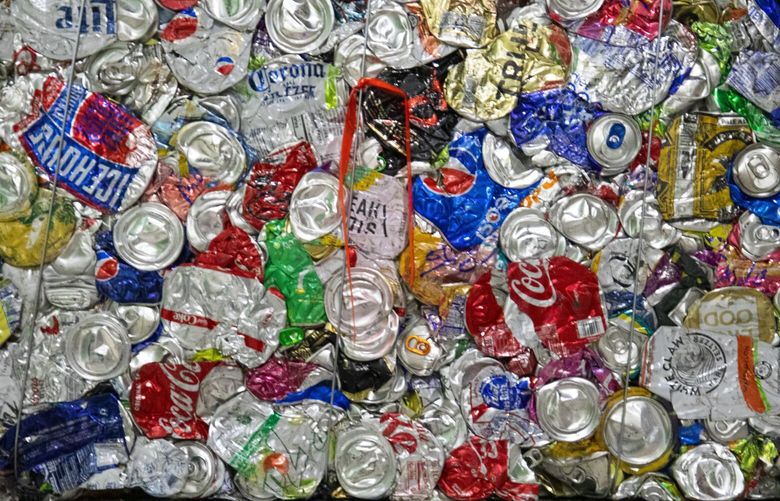 Bales of aluminum cans are ready to be recycled at King County’s Recology’s Material Recovery Facility in Seattle Monday, November 15, 2021. Ten to 15 percent of the items that people put into their blue recycle bins are not recyclable and have to go to landfills.. People who work on the assembly lines spend a lot of time in quality control and do their best to remove these items. Shot Monday, November 15, 2021.
Monday is ‘America Recycles’ day and King County Solid Waste Division wants to remind everyone as we head into the busy holiday shopping, shipping, packaging, and cooking season that plastic bags, wrap, and other non-recyclable items should not be put in the recycling bin.
Items that belong in the bins are clean and dry hard plastics, paper, glass, cardboard and metals. Plastic bags and wraps should not be placed in recycling bins and can damage or temporarily shut down the equipment. It usually happens at least once a day and several hours every night are removing plastic bags and other items that have wound around the paper screens.
“Wish†recycling (items that people try to recycle but shouldn’t) also cause problems with the machinery at the facility.
People in the northwest are generally good recyclers and because of the low contamination rates in recycled items recyclers buy the recycled baled items. Almost all of the baled items end up in domestic markets in the Untied States, Canada and Mexico.
218821