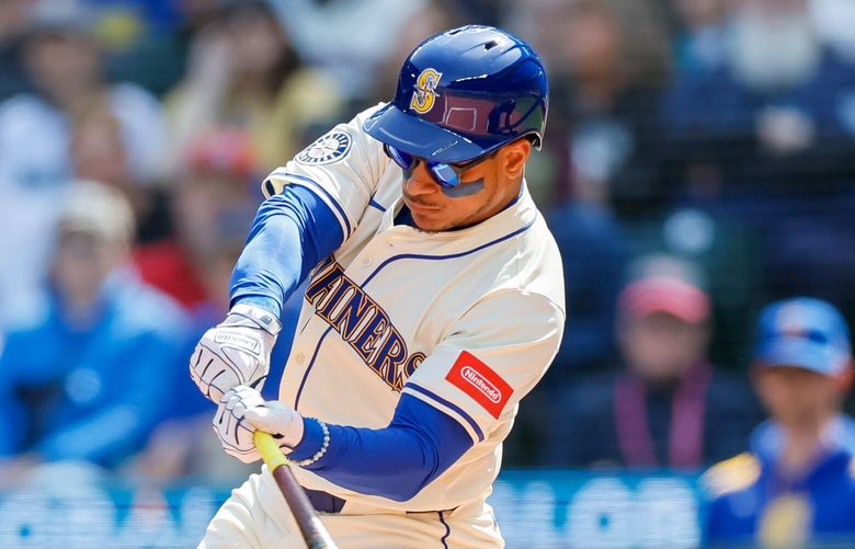 Seattle Mariners designated hitter Jorge Polanco hits a single during the first inning Sunday, April 13, 2025 in Seattle. Polanco would come around to score on a home run by catcher Cal Raleigh. 229712