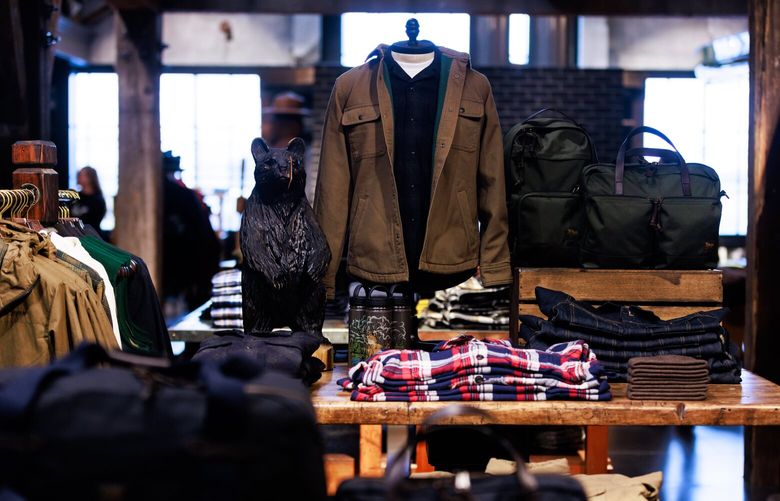 Clothing and bags displayed for sale at the flagship Filson store, Monday, Oct. 2, 2023, in Seattle.
