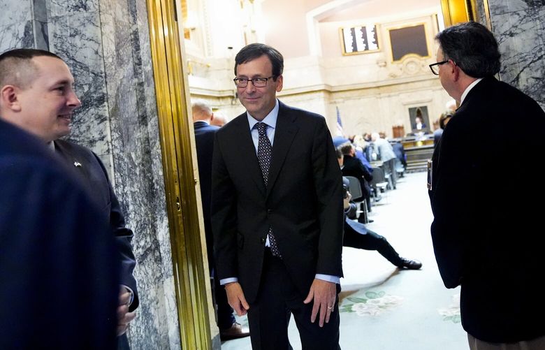 Washington Gov. Bob Ferguson leaves House chambers after giving his inaugural address to a joint legislative session at the Washington State Capitol, Wednesday, Jan. 15, 2025, in Olympia, Wash. (AP Photo/Lindsey Wasson)