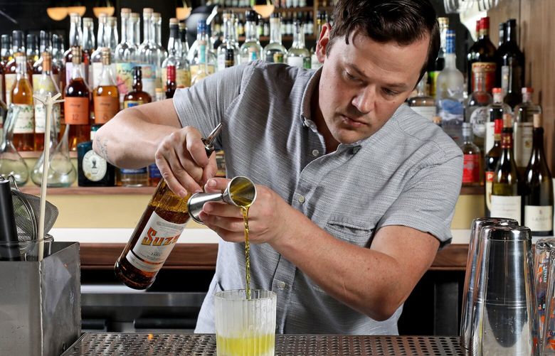 Bartender and bar owner Erik Hakkinen makes a Chambéry Negroni at his new bar Roquette in Bell Town on First Avenue. 210850