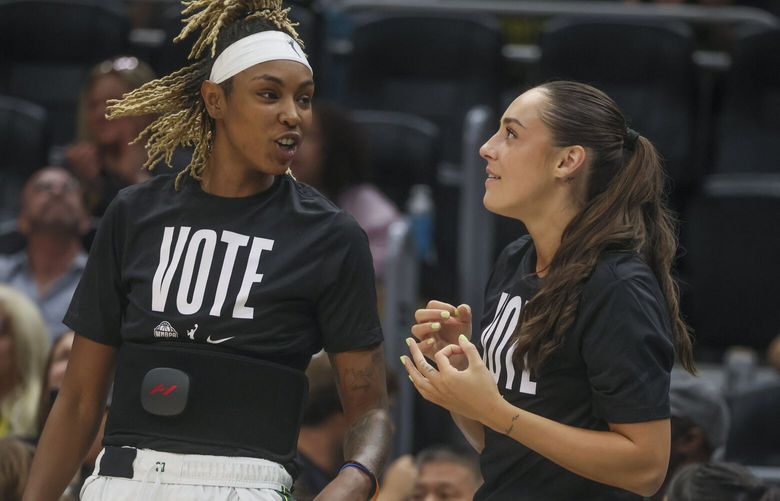 Seattle Storm guard Jordan Horston (23), left, and guard Nika Muhl (1), right, celebrate a three-pointer in the third quarter against the Phoenix Mercury at Climate Pledge Arena in Seattle on Saturday, September 7, 2024.

 227939