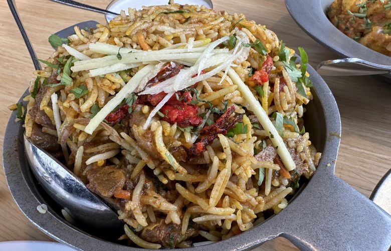 The goat biryani at Renton’s Clove restaurant is a well-spiced mix of tender goat, rice and herbs