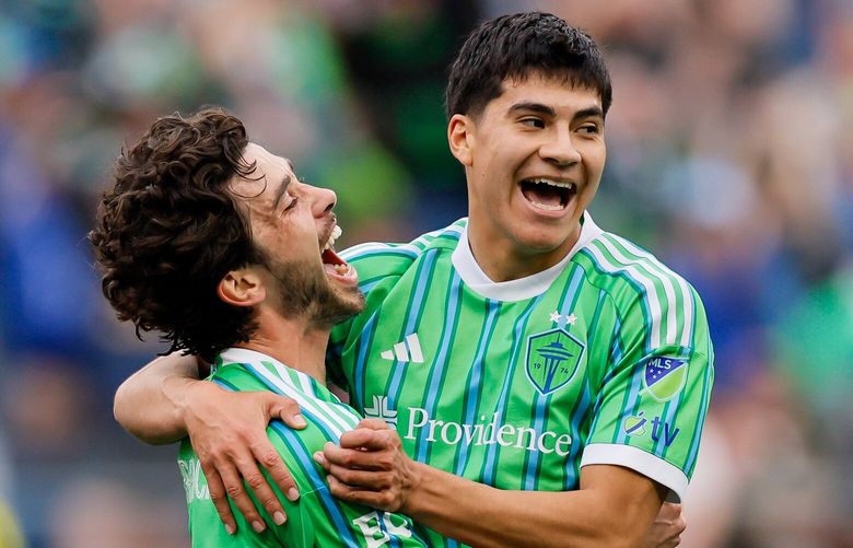 Seattle Sounders FC midfielder Obed Vargas, right, celebrates with Paul Rothrock after Rothrock scored during the first half Saturday, April 19, 2025 in Seattle. 229791