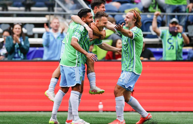 Teammates celebrate with Seattle Sounders FC forward Danny Musovski, center, after Musovski scored during the first half Saturday, April 19, 2025 in Seattle. 229791