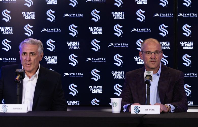 From left, Seattle Kraken general manager Ron Francis, new head coach Dan Bylsma and co-owner Samantha Holloway appear together at a news conference introducing Bylsma, Tuesday, May 28, 2024, in Seattle.