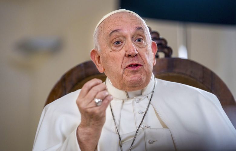 Pope Francis speaks during an interview with The Associated Press at The Vatican, Tuesday, Jan. 24, 2023. Pope Francis said he hasn’t even considered issuing norms to regulate future papal resignations and says he plans to continue on for as long as he can as bishop of Rome, despite a wave of attacks against him by some top-ranked cardinals and bishops. (AP Photo/Domenico Stinellis) XDS116