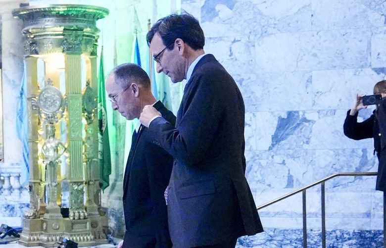 Washington Gov. Bob Ferguson leaves House chambers after giving his inaugural address to a joint legislative session at the Washington State Capitol, Wednesday, Jan. 15, 2025, in Olympia, Wash.