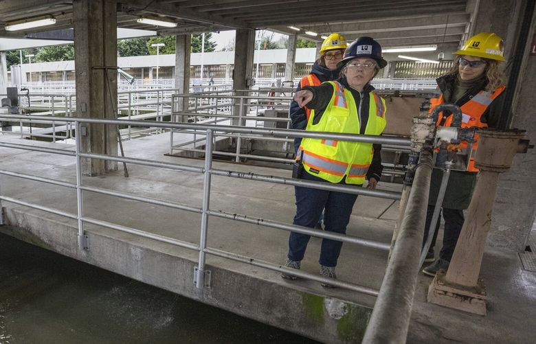 Rebecca Singer, wastewater operations manager for King County, talks about the wastewater treatment at the King County South Treatment Plant in Renton, Friday, January 10, 2025.  At left is Alison Hawkes, communications manager and at right is Erika Kinno, CQ  research and policy project manager.

At the South Treatment Plant, located at 1200 Monster Rd. SW, they treat wastewater into a type of soil that can be used to grow food and is currently in use in Douglas County.
 228923