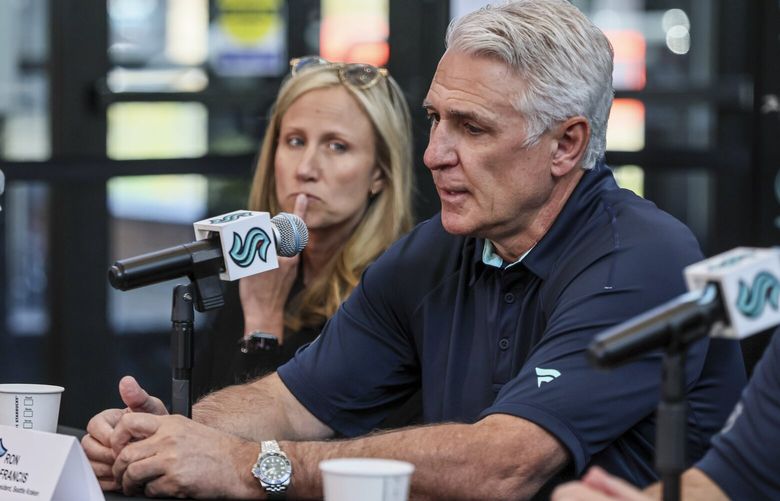 Samantha Holloway, far left, Owner and Chair of Seattle Kraken, looks on as Ron Francis, President, fields a question during a press conference Tuesday afternoon at Kraken Community Iceplex in Seattle, Washington, on April 22, 2025. 229859