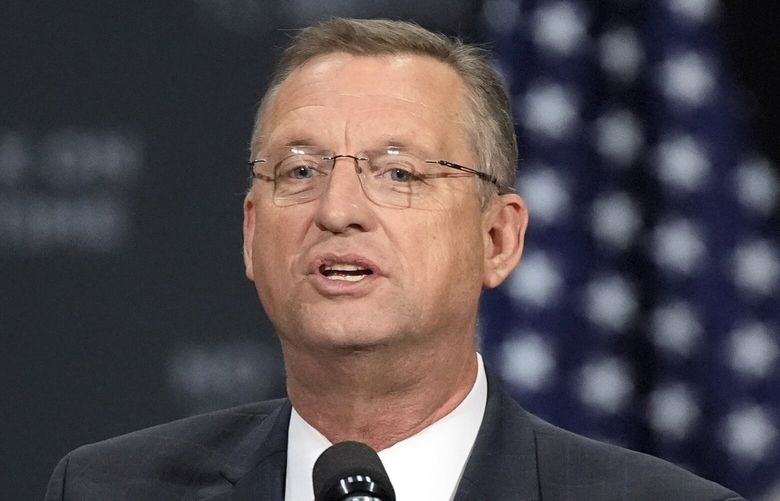 Former Rep. Doug Collins speaks before Republican presidential nominee former President Donald Trump at a campaign event at the Cobb Energy Performing Arts Centre, Oct. 15, 2024, in Atlanta. (AP Photo/John Bazemore, File) WX107 WX107