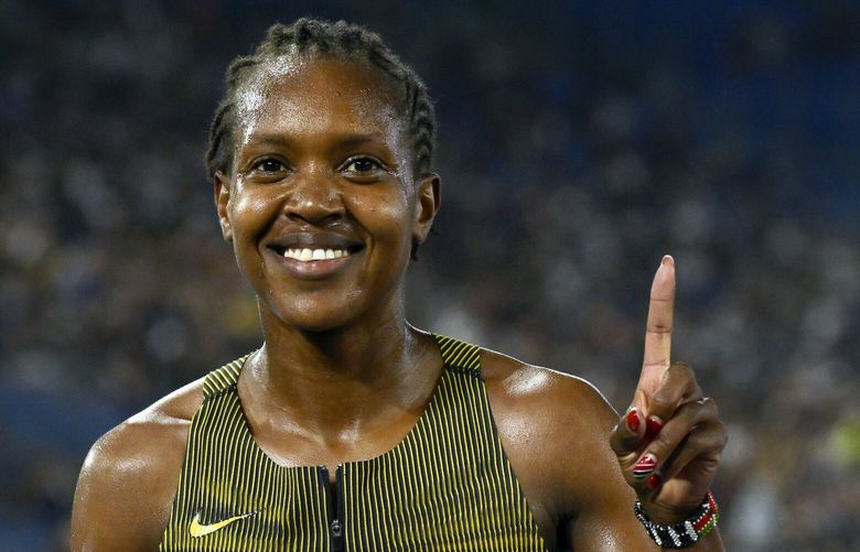 FILE – Faith Kipyegon, of Kenya, poses after winning the women’s 1500 meters during the Diamond League Golden Gala Pietro Mennea athletics meet at the Stadio Olimpico in Rome, Aug. 30, 2024. (AP Photo/Antonietta Baldassarre, File) RPJP101 RPJP101