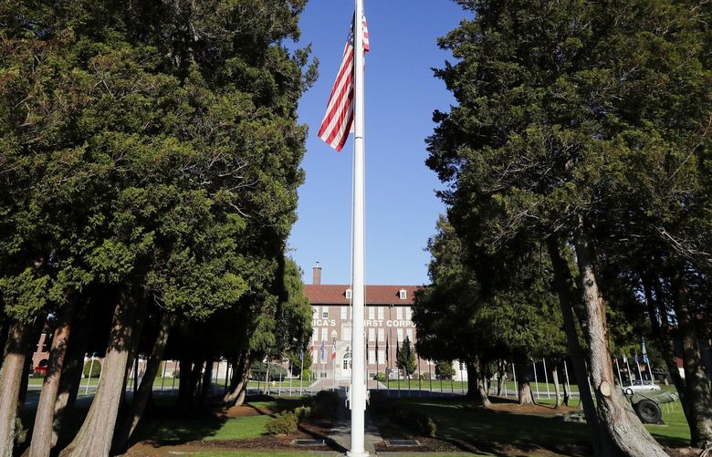 The main flag pole in front of the U.S. Army I Corps headquarters on Joint Base Lewis-McChord, south of Tacoma, Wash., hangs at half-staff, Wednesday, Dec. 5, 2018, as part of a national day of mourning for former President George H.W. Bush, who died Nov. 30, 2018. Most personnel on the base were excused from work for the day.