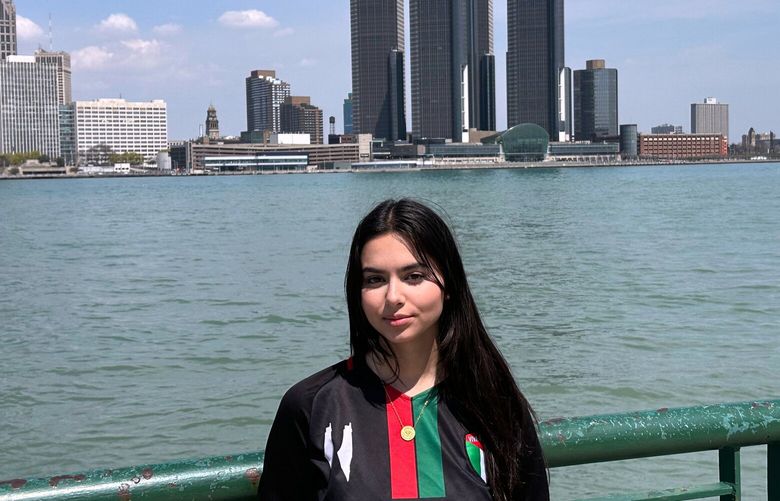Yara Alfaqeeh, 20, stands along the Windsor, Ontario, Canada side of the Detroit River on Wednesday, April 23, 2025.  (AP Photo/Corey R. Williams) RPCW101 RPCW101