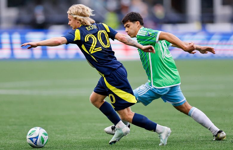 Nashville SC midfielder Edvard Tagseth tries to dribble around Seattle Sounders FC midfielder Obed Vargas during the second half Saturday, April 19, 2025 in Seattle. 229791