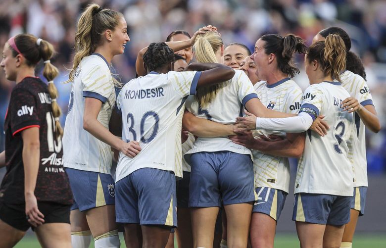 Seattle Reign celebrate a goal by Seattle Reign forward Maddie Dahlien in the first half against Portland Thorns FC Friday evening at Lumen Field in Seattle, Washington, on April 18, 2025. The Reign lead 1-0 at the half. 229790