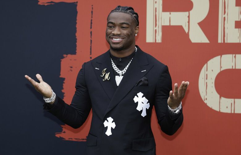 Alabama quarterback Jalen Milroe poses on the carpet before the first round of the NFL football draft, Thursday, April 24, 2025, in Green Bay, Wis. (AP Photo/Matt Ludtke) WIJL108 WIJL108