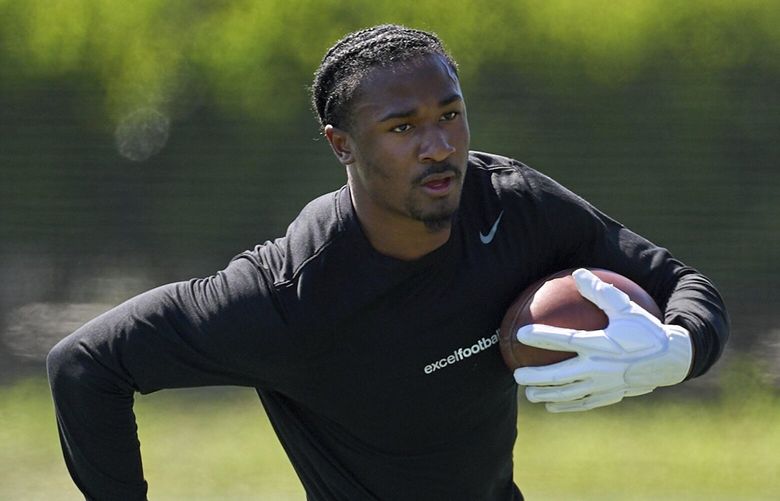 Wide receiver Tory Horton trains for the NFL football draft at Lake Forest Sports Park in Lake Forest, Calif., on Friday, March 21, 2025. (AP Photo/Damian Dovarganes) CADD503 CADD503