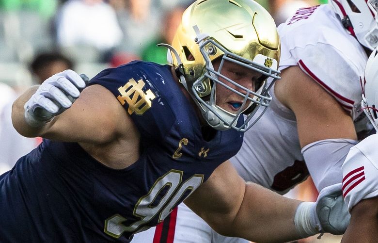 Notre Dame defensive lineman Rylie Mills (99) goes to tackle Miami (Ohio) running back Keyon Mozee (3) during the second half of an NCAA college football game, Saturday, Sept. 21, 2024, in South Bend, Ind. (AP Photo/Michael Caterina)