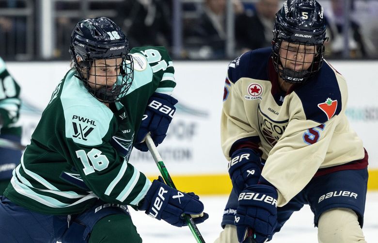 Montreal Victoire defender Anna Wilgren battles for the puck with Boston Fleet forward Amanda Pelkey during a PWHL hockey game on Sunday, Jan. 5, 2025, in Seattle.