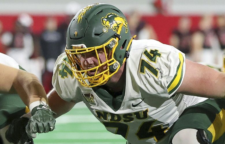 North Dakota State linemen Grey Zabel (74) sits back waiting for South Dakota defenders to rush during the PAT attempt during the second half of an NCAA college football game Saturday, Nov. 23, 2024, in Vermillion, S.D. (AP Photo/Josh Jurgens)