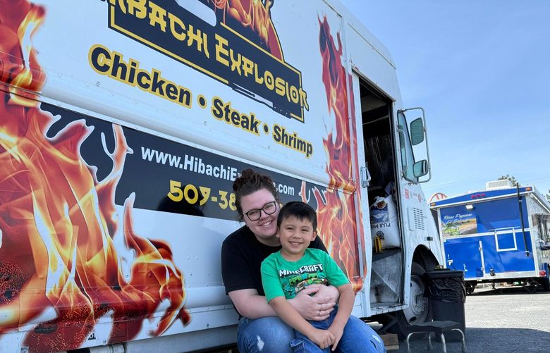Gabrielle Cerdio and her son, Colter, 5, pose in front of Hibachi Explosion, a Kennewick food truck. Immigration officials took her husband, Sergio Cerdio Garcia, into custody during a scheduled interview in Yakima.