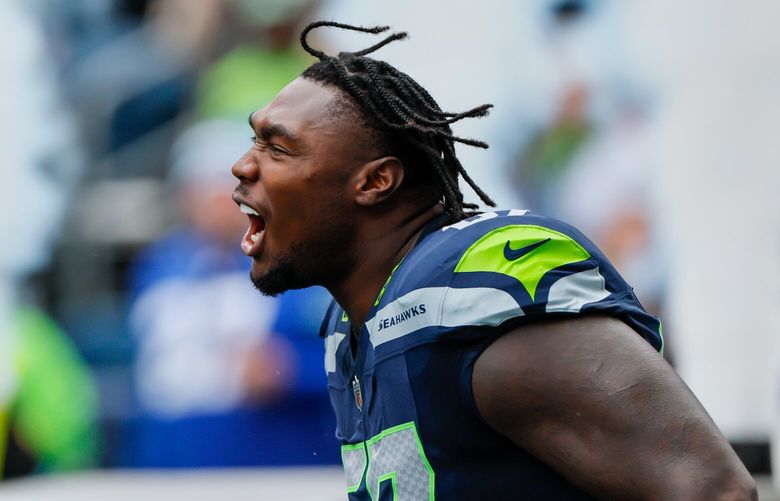Seattle Seahawks offensive tackle Charles Cross yells out as he runs out of the tunnel before the start of a game against the Arizona Cardinals Sunday, Nov. 24, 2024 in Seattle. 228598