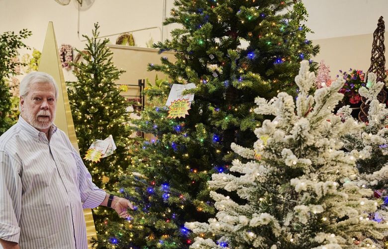 Larry Gold, the owner of Aldik Home, with artificial Christmas trees at his store in Los Angeles, April 28, 2025. “I can’t believe anybody in this country who is buying trees from China will pay the 145 percent duty, because they’ll never sell them,” Gold said. (Colin Sussingham/The New York Times) XNYT0975 XNYT0975