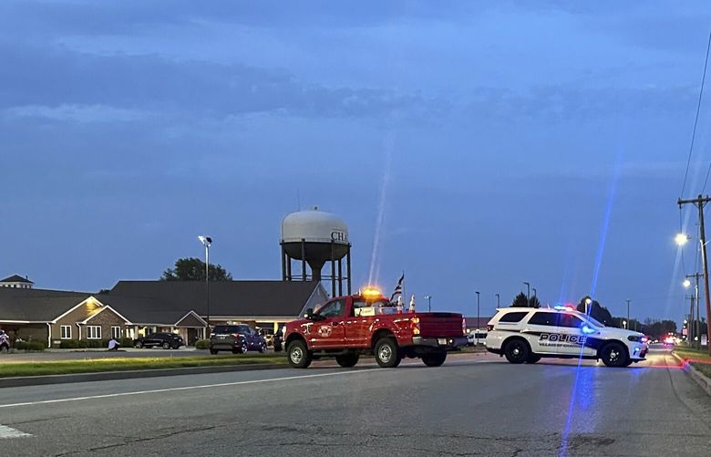 Emergency vehicles block a road leading to a building where a car smashed through during an after-school program, killing several people and injuring others, Monday, April 28, 2025, in Chatham, Ill. (AP Photo/John O’Connor) XKS101 XKS101