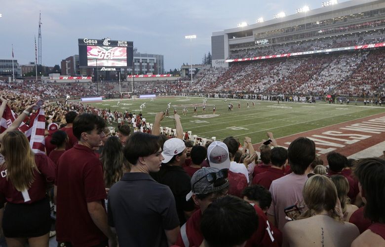 Fans in the Washington State student section watch the first half of an NCAA college football game between Washington State and Texas Tech at Gesa Field at Martin Stadium , Saturday, Sept. 7, 2024, in Pullman, Wash. (AP Photo/Young Kwak) OTK OTK