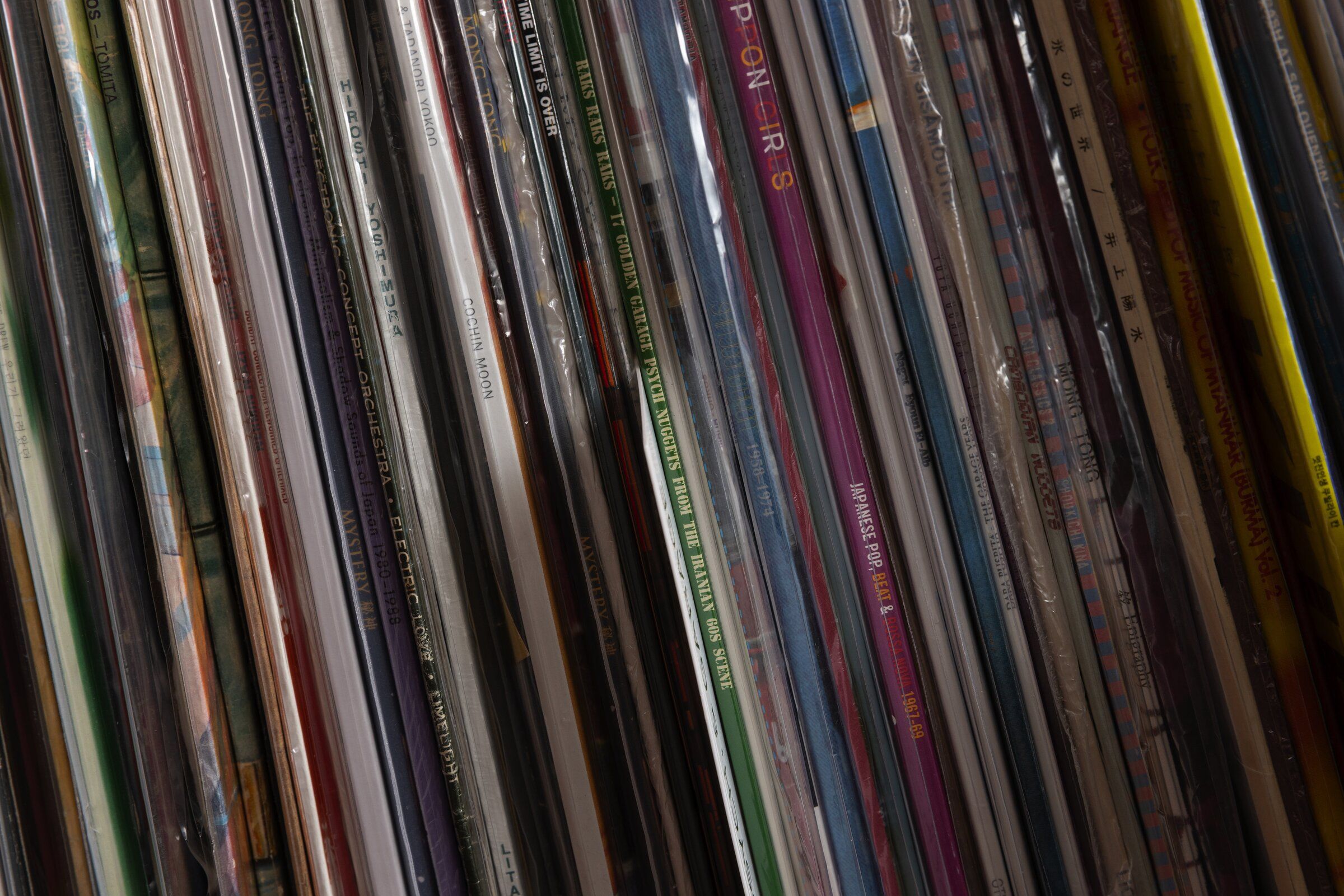 Some of the records included in a collection of the Sea Vinyl Society, Sunday, April 6, 2025, in Seattle. Thanh Tan started the group which centered around pre-1975 Vietnamese vinyl records, but the collection has grown to encompass many other countries, shown here. (Ken Lambert / The Seattle Times)