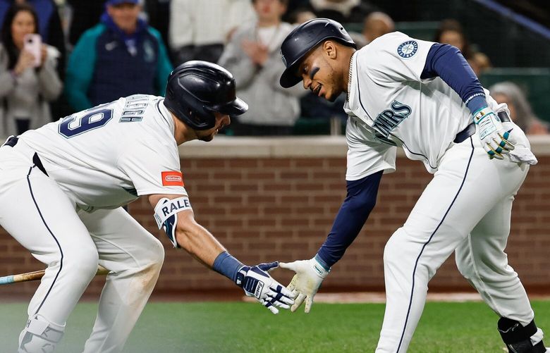 Jorge Polanco celebrates his second home run of the night with Cal Raleigh.  The Los Angeles Angels played the Seattle Mariners in Major League Baseball Tuesday, April 29, 2025 at T-Mobile Park, in Seattle, WA. 229850