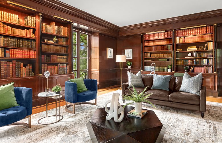 Texture and variation of color help to make a vintage-inspired area rug the main attraction in this library. (Sotheby’s International Realty/TNS)