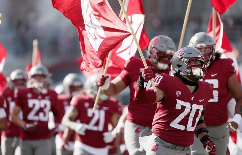 Washington State players run on the field before an NCAA college football game against Hawaii, Saturday, Oct. 19, 2024, in Pullman, Wash. (AP Photo/Young Kwak) OTK OTK