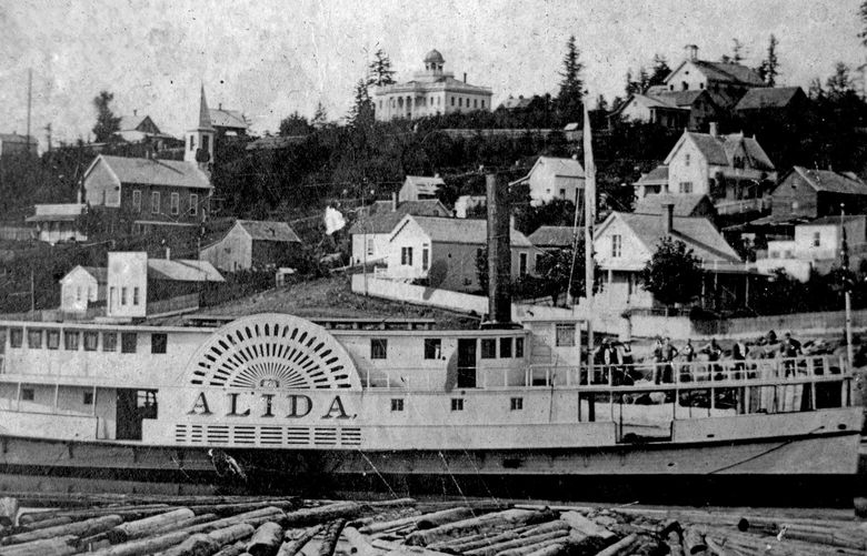 The sidewheeler Alida is shown in 1870 from the north end of Yesler’s Wharf. Logs in the foreground were destined for Yesler’s sawmill, only blocks away. This photo is the second earliest extant portrait of Seattle’s waterfront. To see the oldest, taken one year earlier, visit PaulDorpat.com. (Courtesy Ron Edge)