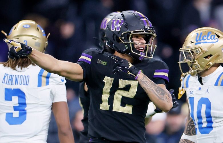 Washington Huskies wide receiver Denzel Boston signals first down during the fourth quarter Friday, Nov. 15, 2024 in Seattle. 228521